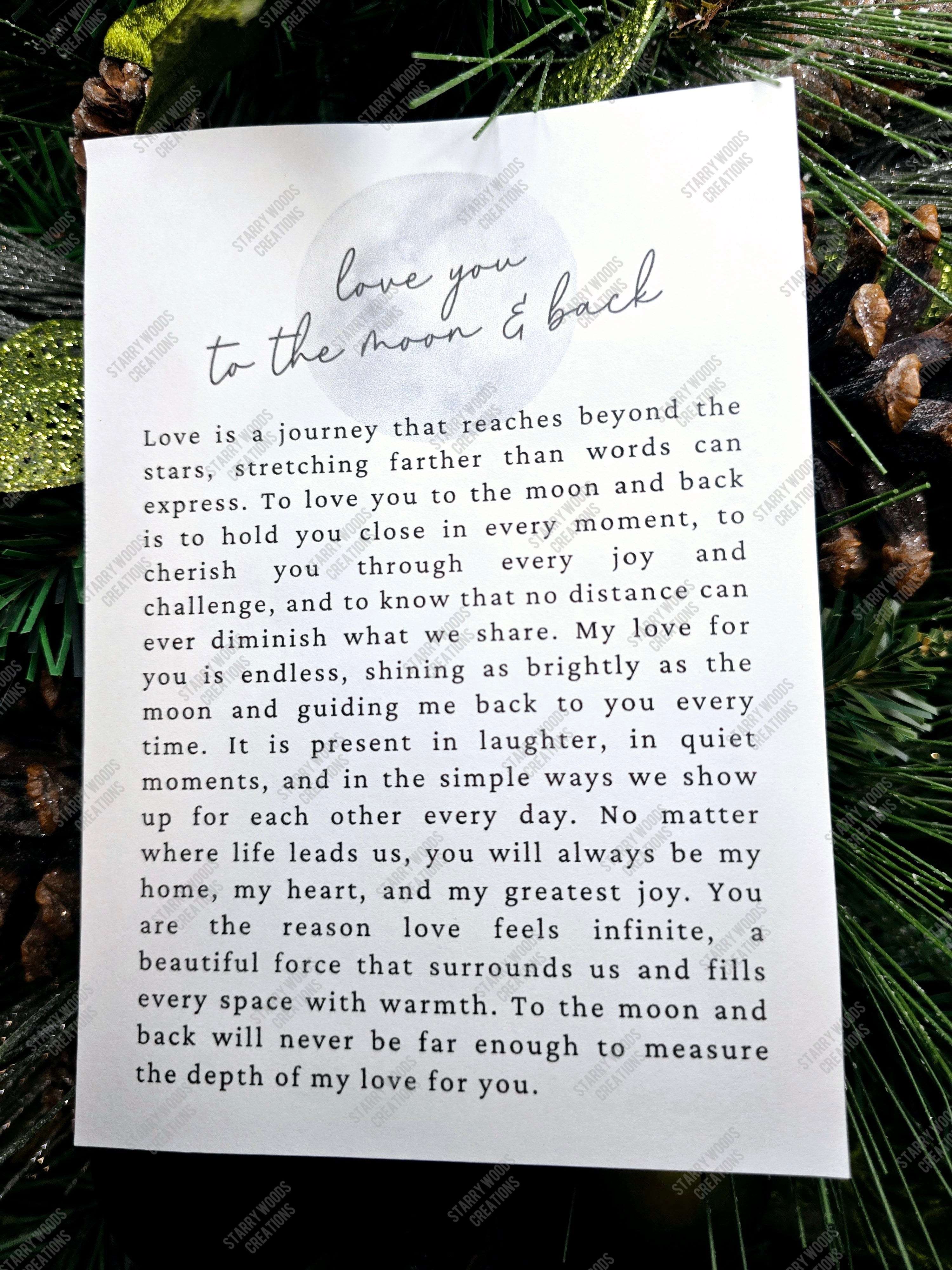Love You to the Moon and Back story card with greenery in the background